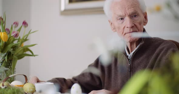 Senior Man, Retirement. Lonley Senior Man Siting Alone at Table