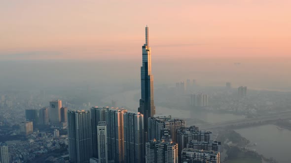 Drone view of skyscraper in Ho Chi Minh city in a foggy morning.