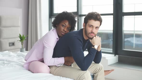 Faithful, Affectionate African Woman Is Sitting Behind and Hugging Tenderly Her Handsome Husband