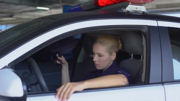 Tired Police Woman Taking Off Hat, Sitting in Squad Car, Exhausted Sub Work