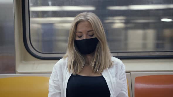 Woman in Subway Train