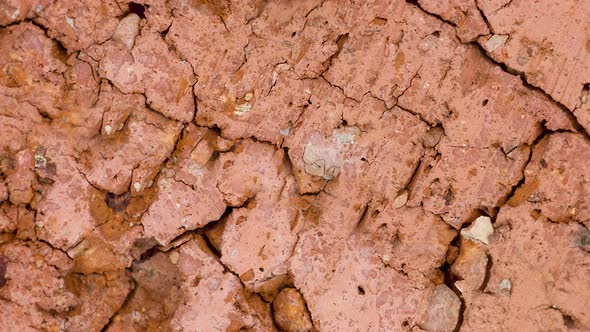 Texture of Cracked Red Old Brick Closeup