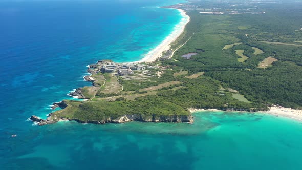 Macao Beach with Turquoise Water and Stone Cliff