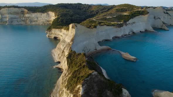 Drone Over Coastline Cliffs And Sea At Sunrise Of Cape Drastis