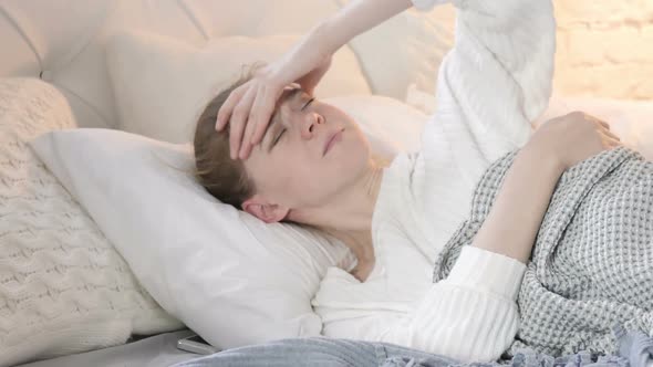 Tense Woman with Headache Sleeping in Bed