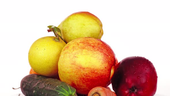 Delicious Fruit and Vegetables with Water Drops on White