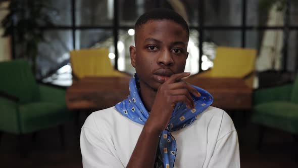 Crop View of Young Stylish Afro American Guy Propping and Turning Head While Looking to Camera