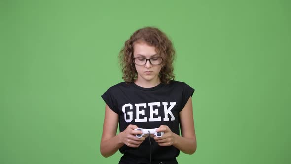 Young Beautiful Nerd Woman Wearing Eyeglasses While Playing Games