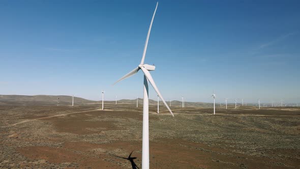 Progressive Clean Energy Wind Turbine Aerial View With Propellers Spinning Fast