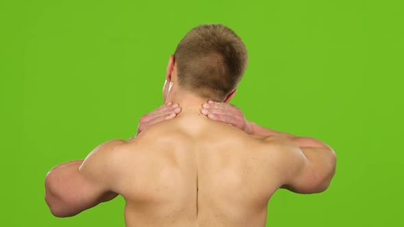 Man Suffers From Pain in Neck, Back View, Green Screen