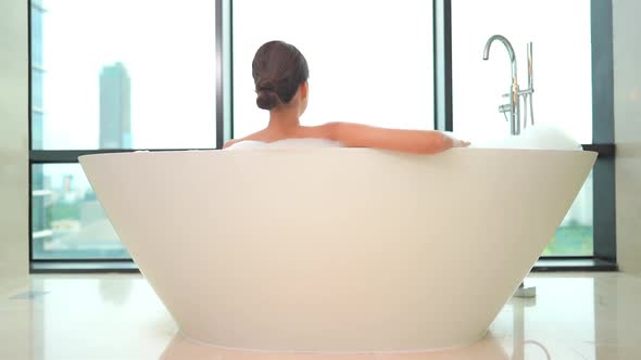 Young asian woman relax in bathtub