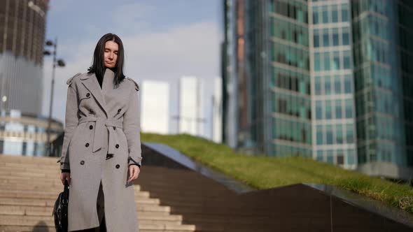 Female Office Worker is Going to Work in Morning in Autumn Portrait of Woman in City