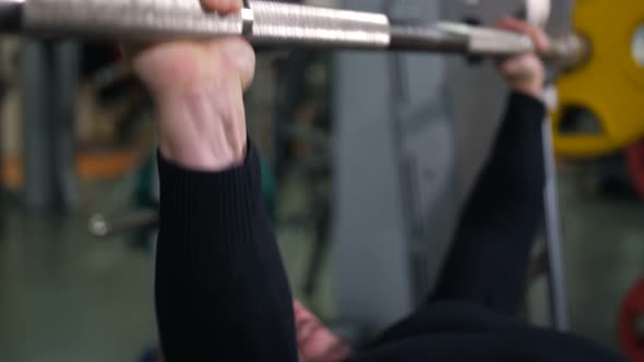 Close Up of the Hands of a Man Raising the Barbell  Slow Mo