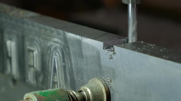 CNC Router working with an aluminum piece close up