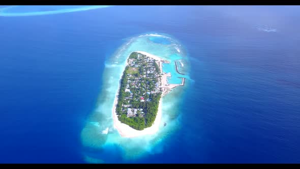 Aerial sky of perfect seashore beach lifestyle by turquoise lagoon with white sand background of a p