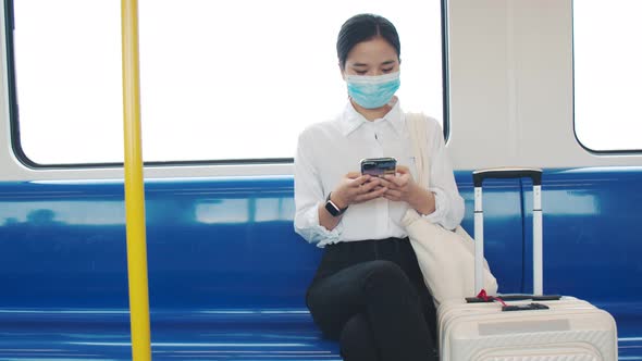 Young Asian passenger wears a surgical mask in the train.