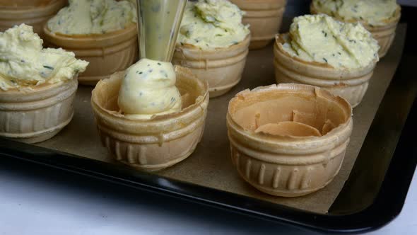 Basketshaped Tartlets with Soft Cheese or Cream Cheese Filling and Dill Decorate