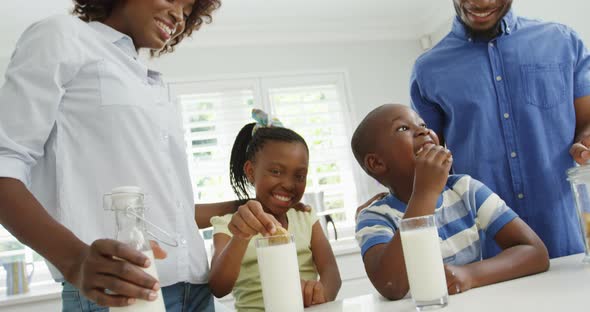 Children with parents eating cookies