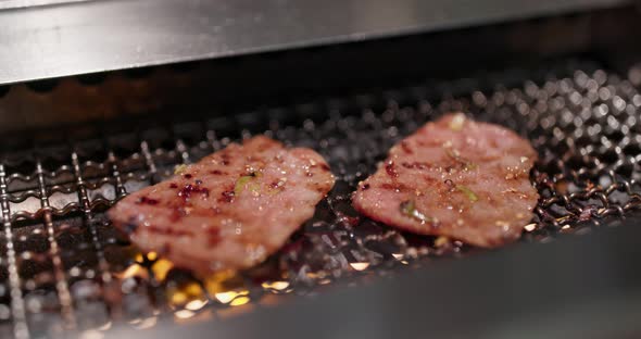 Japanese barbecue in the restaurant, grill wagyu on metal net