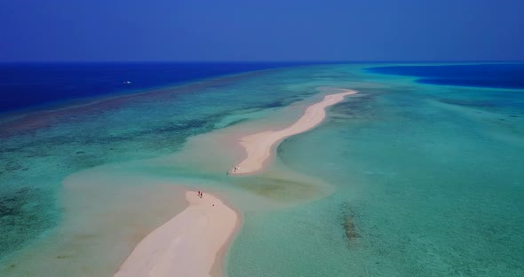 Tropical fly over clean view of a summer white paradise sand beach and aqua blue water background in