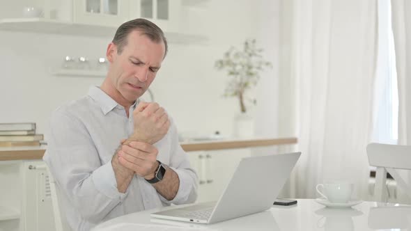 Exhausted Middle Aged Man Having Wrist Pain