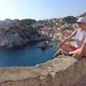 Woman Sitting on Top of Dubrovnik City of Croatia - VideoHive Item for Sale