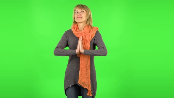 Middle Aged Blonde Woman Is Daydreaming and Smiling Looking Up