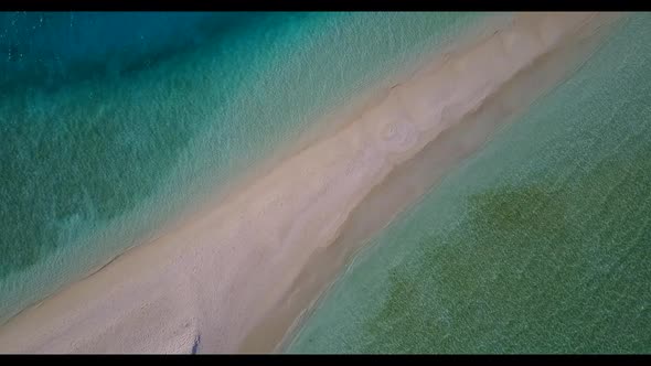 Aerial above seascape of marine coastline beach adventure by clear ocean and white sandy background 