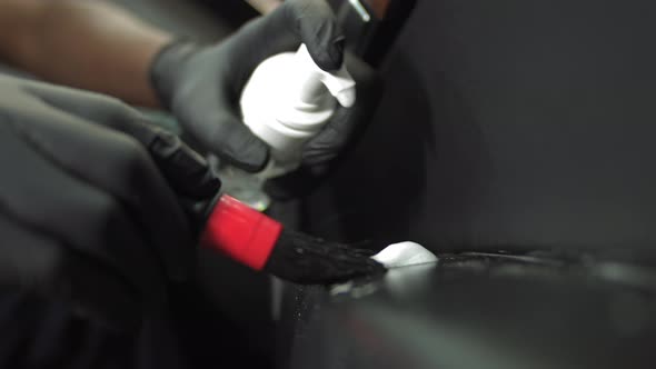 Closeup of an AfricanAmerican Man's Hands Cleaning with a Brush and Foam From