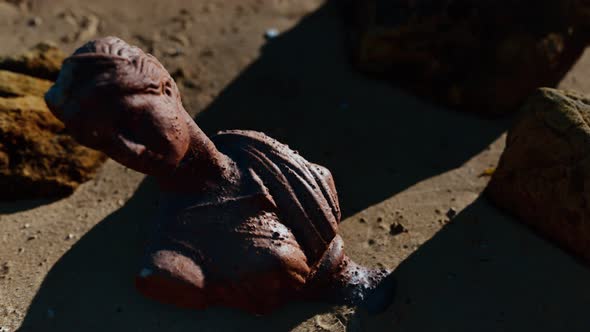 Ancient Woman Bust at Sand Beach alt
