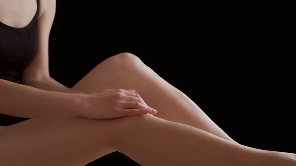 Woman Massaging Her Painful Knee Joint