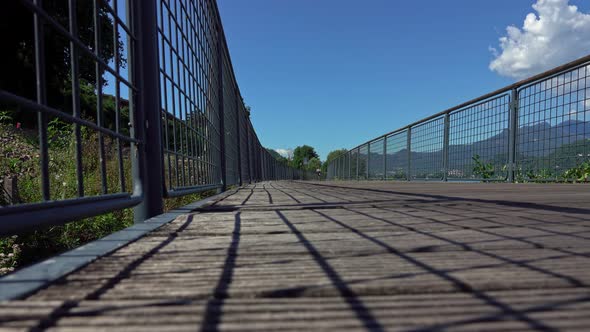 woman riding bicycle on lake bike trail