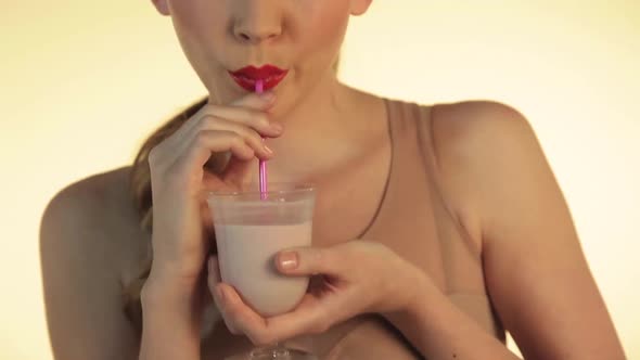 Woman drinking milkshake