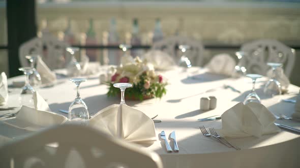 Place settings, Tables, And Chairs are Empty Before the Guests Arrive at a Wedding Reception