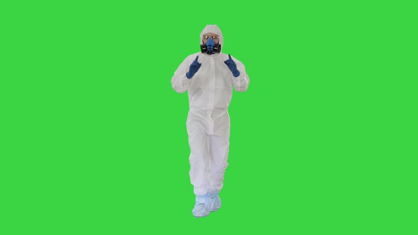 Man in Hazamat Suit Walking and Dancing Covid-19 Concept on a Green Screen, Chroma Key