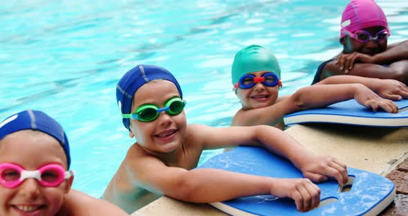 Cute little kids in the swimming pool