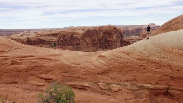 Summit fly over with hiker in Moab