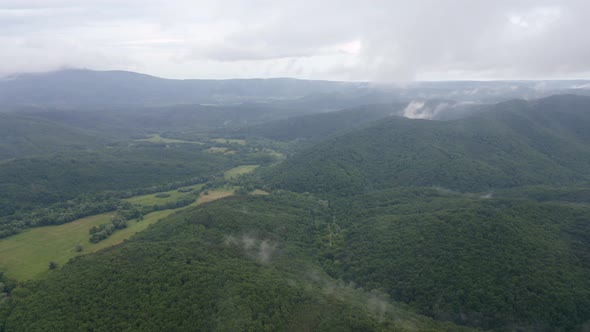 Drone flight over green mountain slopes