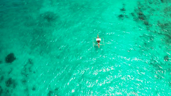 Seascape, Coral Reef and Blue Sea with Motorboat