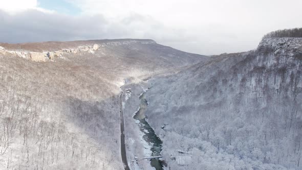 Aerial View of Plateau LagoNaki Mountain Twisted Road in the Winter and Driving Car