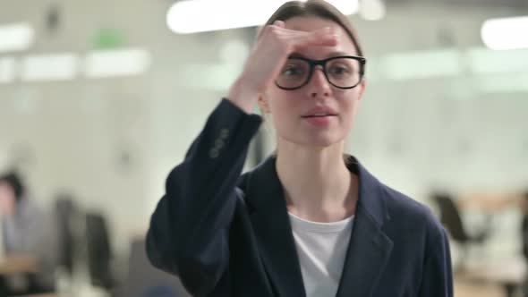 Portrait of Curious Young Businesswoman Looking Around, Searching 