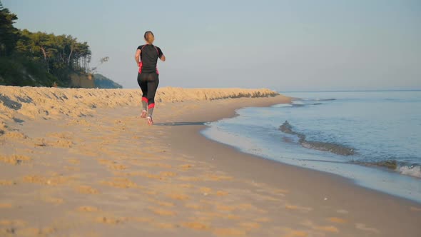 Woman Runs on Sea Beach