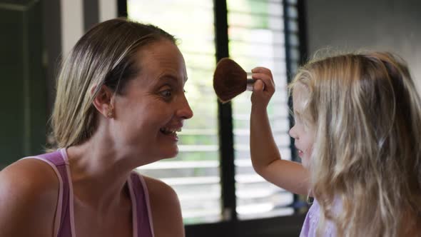 Daughter making up her mother