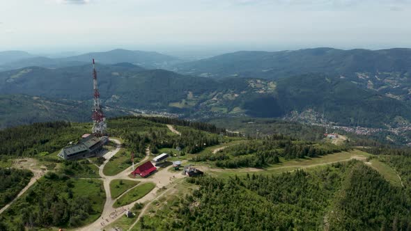 Aerial shot of Polish mountains in the Silesian Beskid. Skrzyczne hill, gsm tower transmitter and to