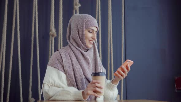 Muslim Woman with a Smartphone.