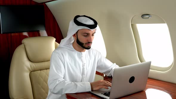 Arabian man flying on his Private jet to dubai.