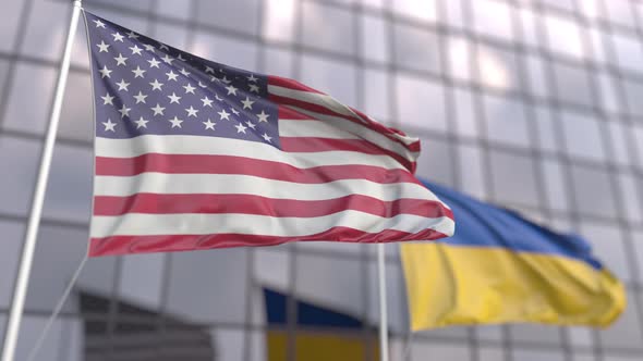 Waving Flags of the United States and Ukraine in Front of a Building