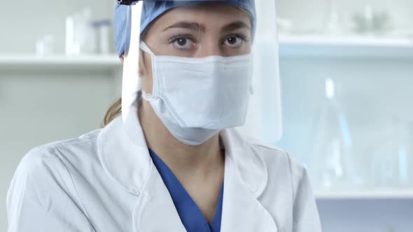 Female Doctor wearing face mask and shield