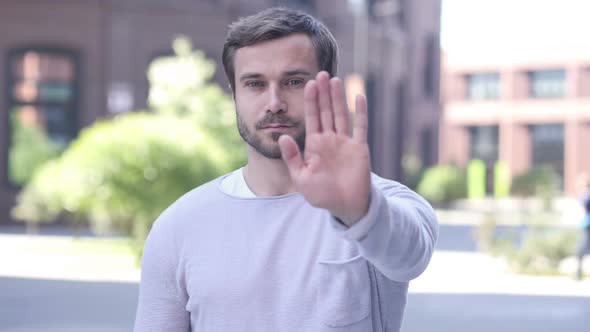 Not Allowed Gesture of Stop By Handsome Man Standing Outside