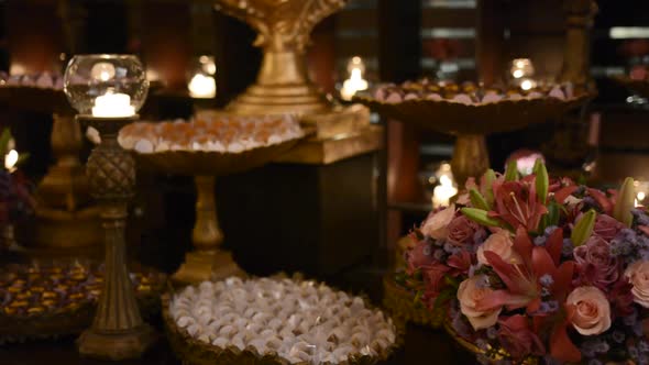 Closeup of party candy, brigadier, cameo, well married. Beautiful flower bouquets and candlelight ca